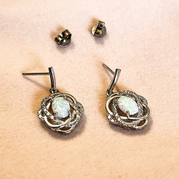 Lab created opals set in silver earrings. - Picture 2 of 6